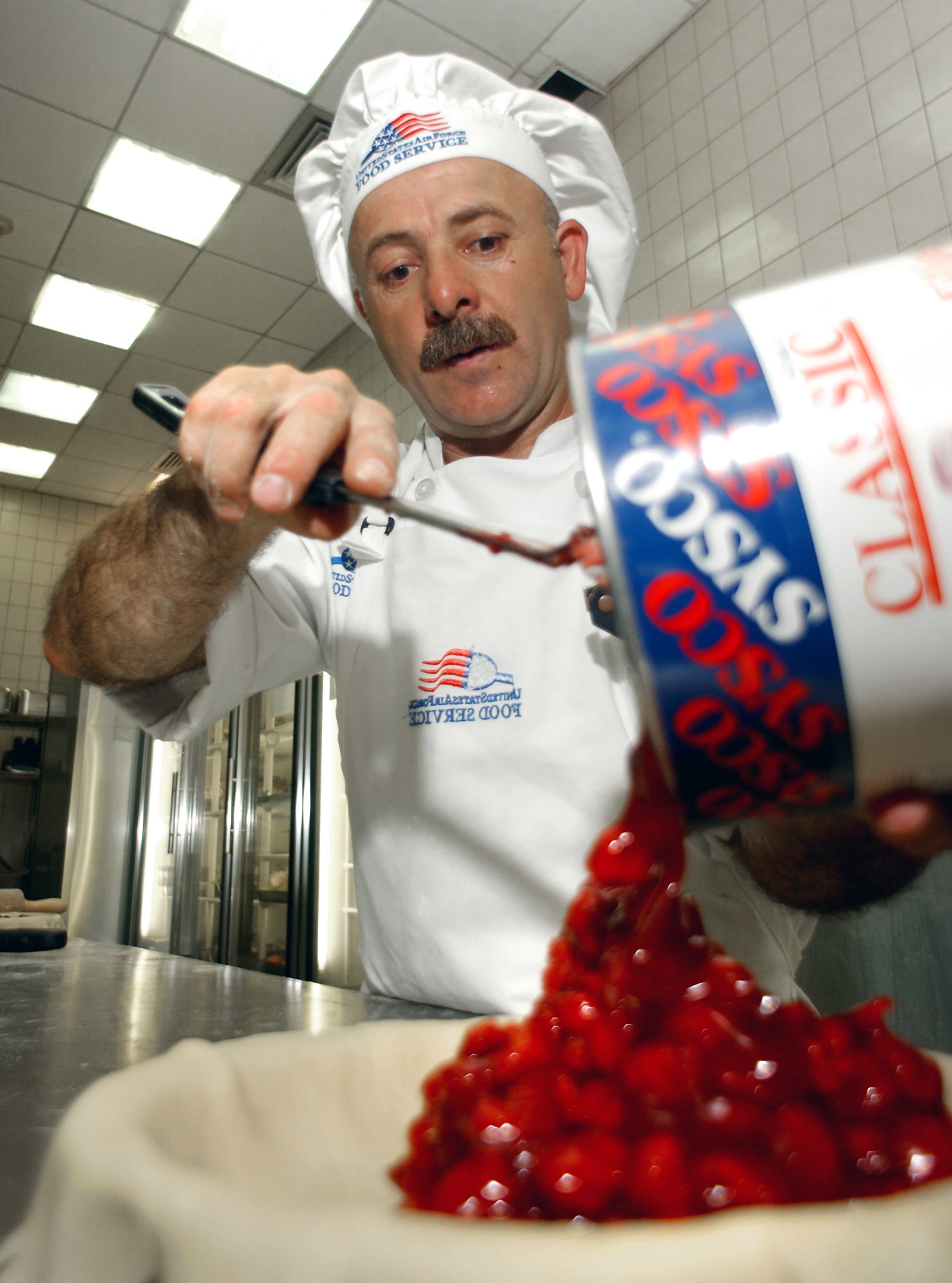 INCIRLIK AIR BASE, Turkey -- Sukru Yasuk, a baker, prepares a cherry pie at the Sultan's Inn.  The dining facility here helped the 39th Services Squadron earn an Air Force-level services award.  (U.S. Air Force photo by Airman 1st Class Michelle Miranda)