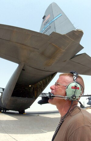 OPERATION IRAQI FREEDOM -- Master Sgt. Scott Nybakken prepares a C-130 Hercules for an airlift mission to Iraq.  Nybakken is a crew chief with the Delaware Air National Guard's 166th Airlift Wing.  Airmen endure temperatures of at least 115 degrees daily on the flightline at their forward-deployed location in Southwest Asia.  (U.S. Air Force photo by Master Sgt. Terry L. Blevins)