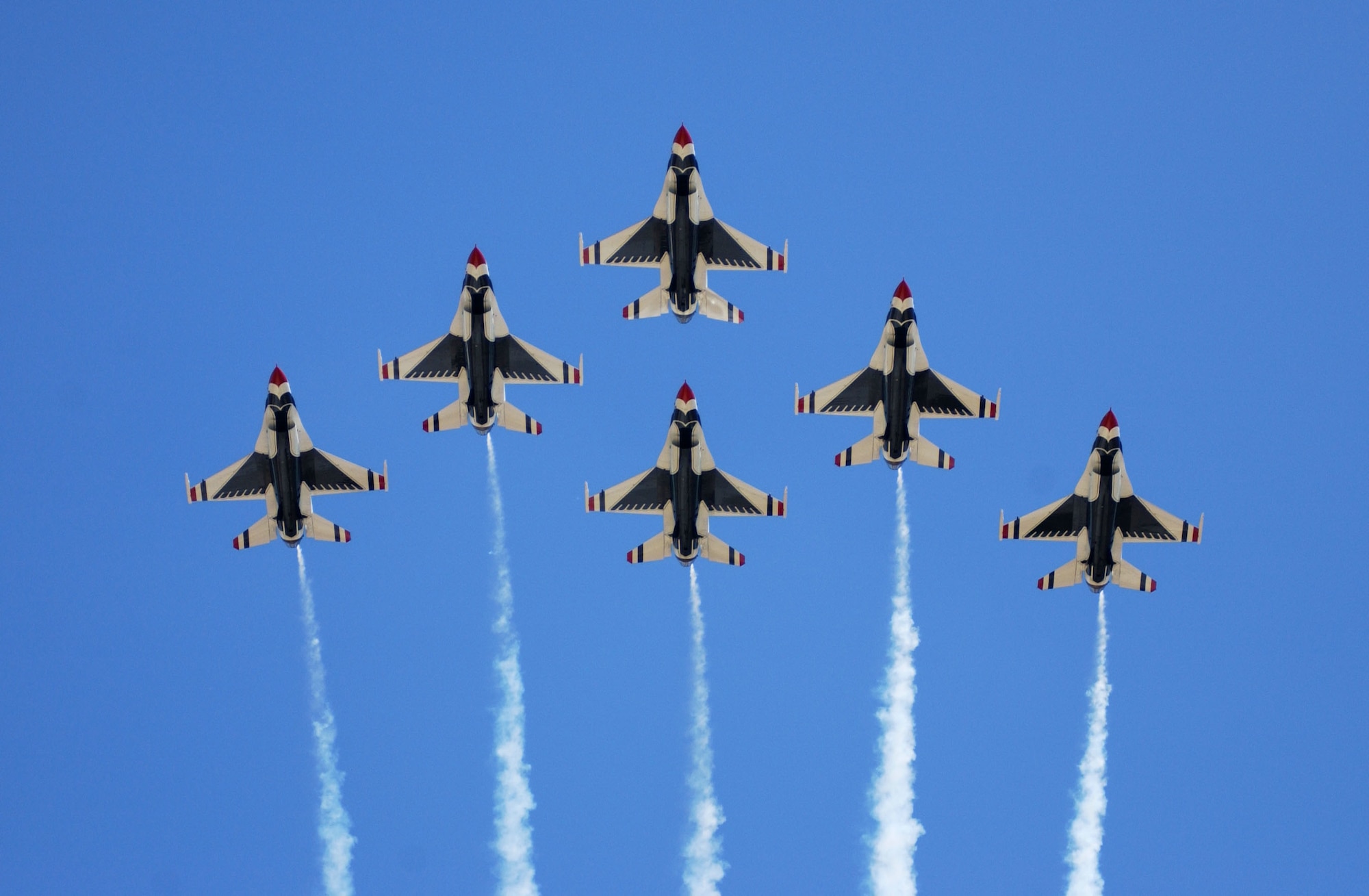 SIOUX FALLS S.D. -- The U.S. Air Force Thunderbirds perform a 6-ship formation fly over during a 2003 airshow.  The team performs precision aerial maneuvers to exhibit the capabilities of modern high-performance aircraft to audiences throughout the world.  (U.S. Air Force photo by Senior Airman Michael Frye)
