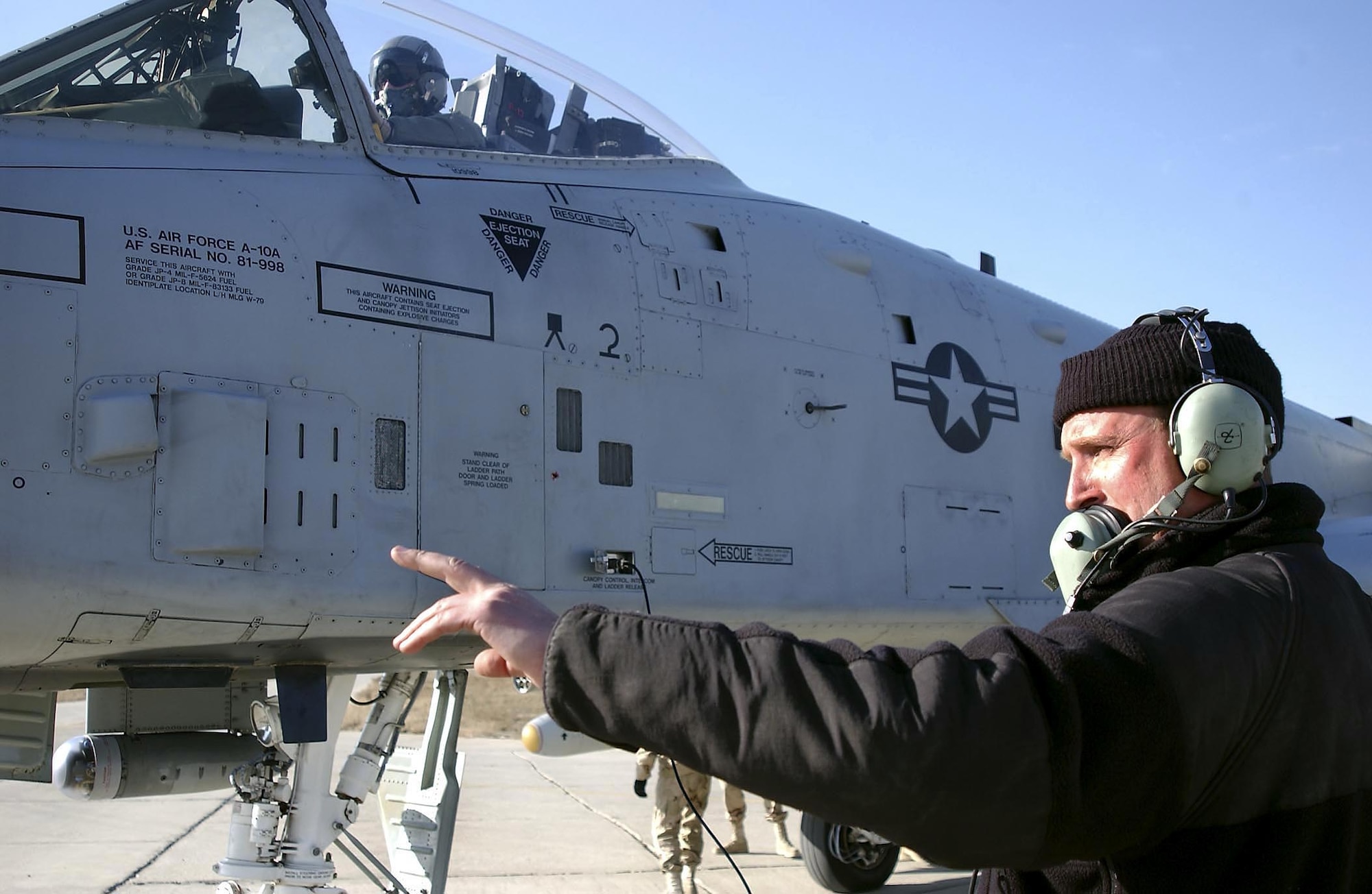 BAGRAM AIR BASE, Afghanistan -- Tech. Sgt. Mike Milewski, a crew chief, talks to the pilot of an A-10 Thunderbolt II ground attack jet here during an end-of-runway check.  Milewski is with the Maryland Air National Guard’s 104th Fighter Squadron’s end-of-runway crew, which is doing a 30-day tour at the base as part of the 455th Expeditionary Operations Squadron.  The crew gives each ground-attack fighter a thorough going over before it departs on a mission.  (U.S. Air Force photo by Master Sgt. Keith Reed)