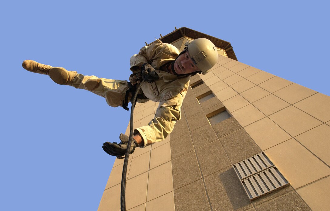 OPERATION IRAQI FREEDOM  --  Senior Master Sgt. Matt Ramp performs a rappelling exercise from the Baghdad International Airport air traffic control tower. Ramp is an Air Force Reserve pararescueman assigned to the 304th Rescue Squadron, Portland International Airport. Squadron members are deployed to Baghdad International Airport supporting Operation Iraqi Freedom.  (U.S. Air Force photo by Master Sgt. James M. Bowman)