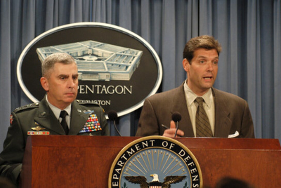 Gen. John P. Abizaid, the newly appointed army officer in charge of U.S. Central Command, joins Special Assistant to the Secretary of Defense Lawrence Di Rita in the Pentagon briefing studio, July 16, 2003, to brief reporters on how he views the current situation in Iraq. 