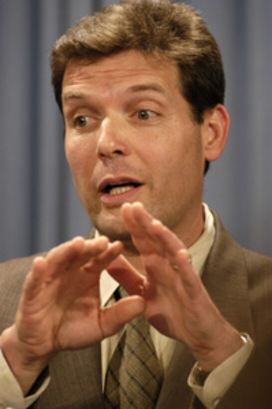 Special Assistant to the Secretary of Defense Lawrence Di Rita clarifies an issue under discussion during a Pentagon briefing on July 16, 2003. 