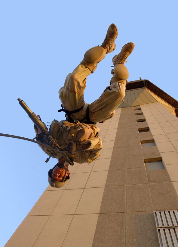 OPERATION IRAQI FREEDOM -- Senior Master Sgt. Matt Ramp, an Air Force Reserve pararescueman assigned to the 304th Rescue Squadron, Portland International Airport, performs a rappelling exercise from the Baghdad International Airport air traffic control tower. Members of the 304th Rescue Squadron are deployed to Baghdad International Airport supporting Operation Iraqi Freedom. (U.S. Air Force photo by Master Sgt. James M. Bowman)