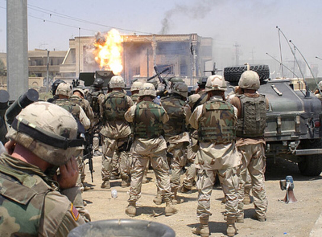 Flame erupts from a building hit with a TOW missile launched by soldiers of the Army's 101st Airborne Division (Air Assault) on July 22, 2003, in Mosul, Iraq. Saddam Hussein's sons Qusay and Uday were killed in a gun battle as they resisted efforts by coalition forces to apprehend and detain them. 