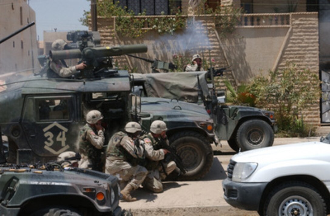 Soldiers of the Army's 101st Airborne Division (Air Assault) fire a TOW missile at a building suspected of harboring Saddam Hussein's sons Qusay and Uday in Mosul, Iraq, on July 22, 2003. Qusay and Uday were killed in a gun battle as they resisted efforts by coalition forces to apprehend and detain them. 