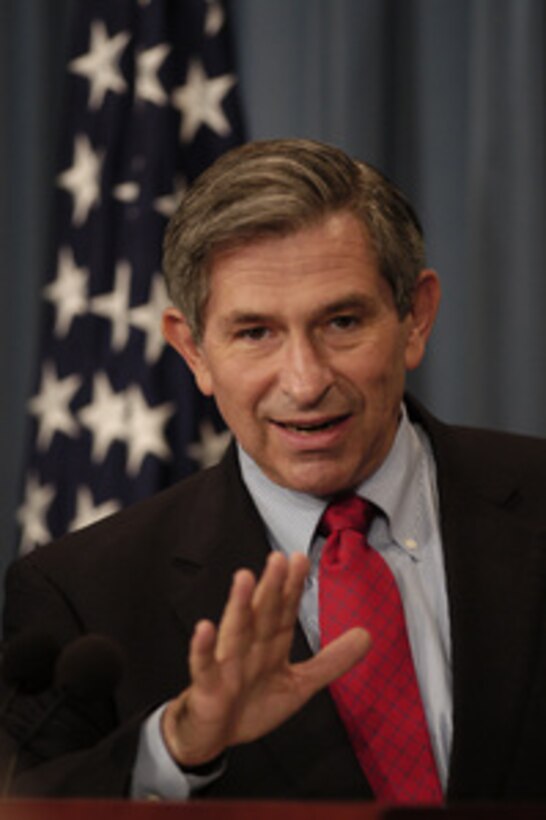 Deputy Secretary of Defense Paul Wolfowitz gestures as he answers a reporter's question about his trip to Iraq during a Pentagon press briefing on July 23, 2003. Wolfowitz visited with the senior military and civilian leadership and deployed troops in Iraq. 