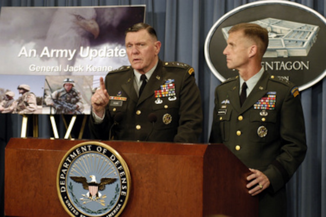 Acting Army Chief of Staff Gen. John M. Keane (left) and Vice Director for Operations, J-3, Joint Staff Maj. Gen. Stanley A. McChrystal (right) brief reporters on how the U.S. Army is organizing to rotate forces supporting Operation Iraqi Freedom during a Pentagon press briefing on July 23, 2003. 