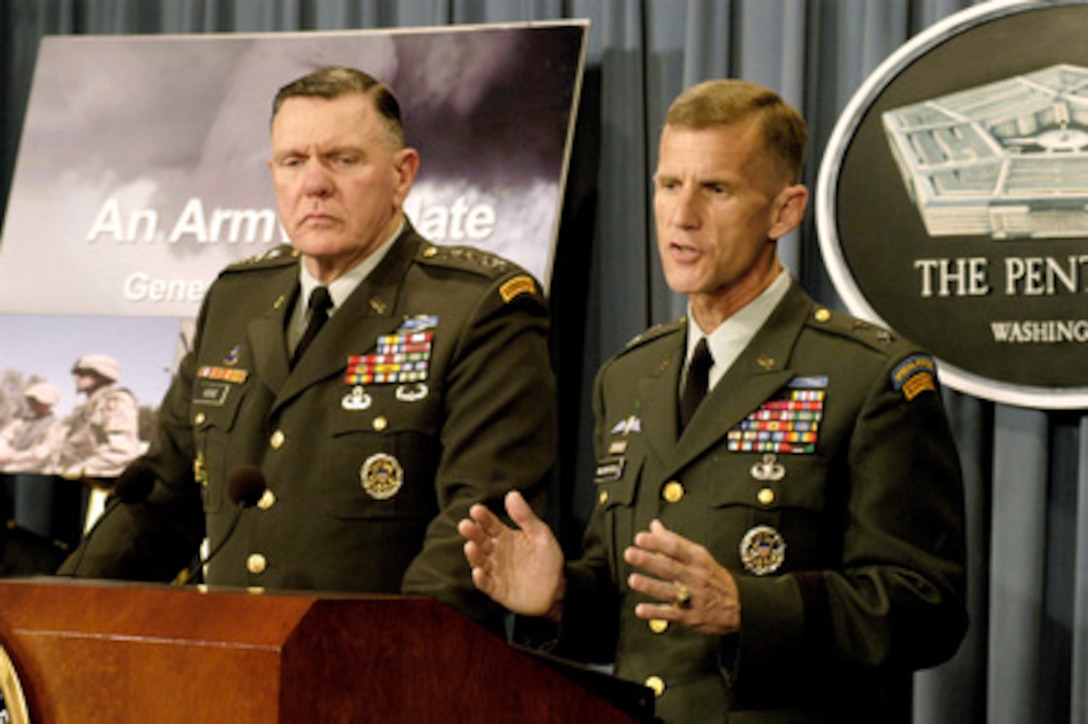 Maj. Gen. Stanley A. McChrystal (right) and Acting Army Chief of Staff Gen. John M. Keane (left) brief reporters on how the U.S. Army is organizing to rotate forces supporting Operation Iraqi Freedom during a Pentagon press briefing on July 23, 2003. McChrystal is the vice director for Operations, J-3, the Joint Staff. 