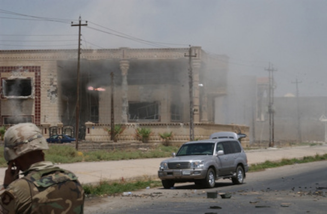 A TOW missile streaks toward a building suspected of harboring Saddam Hussein's sons Qusay and Uday in Mosul, Iraq, on July 22, 2003. Qusay and Uday were killed in a gun battle with soldiers of the Army's 101st Airborne Division (Air Assault) as they resisted efforts by coalition forces to apprehend and detain them. 