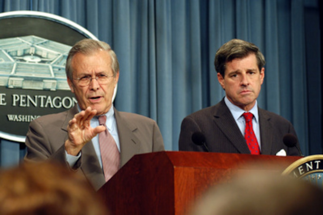 Secretary of Defense Donald H. Rumsfeld gestures to emphasize his point during a press briefing with Ambassador Paul Bremer in the Pentagon on July 24, 2003. Rumsfeld and Bremer briefed reporters about the coalition progress in Iraq. Bremer is the administrator of the Coalition Provisional Authority in Iraq. 