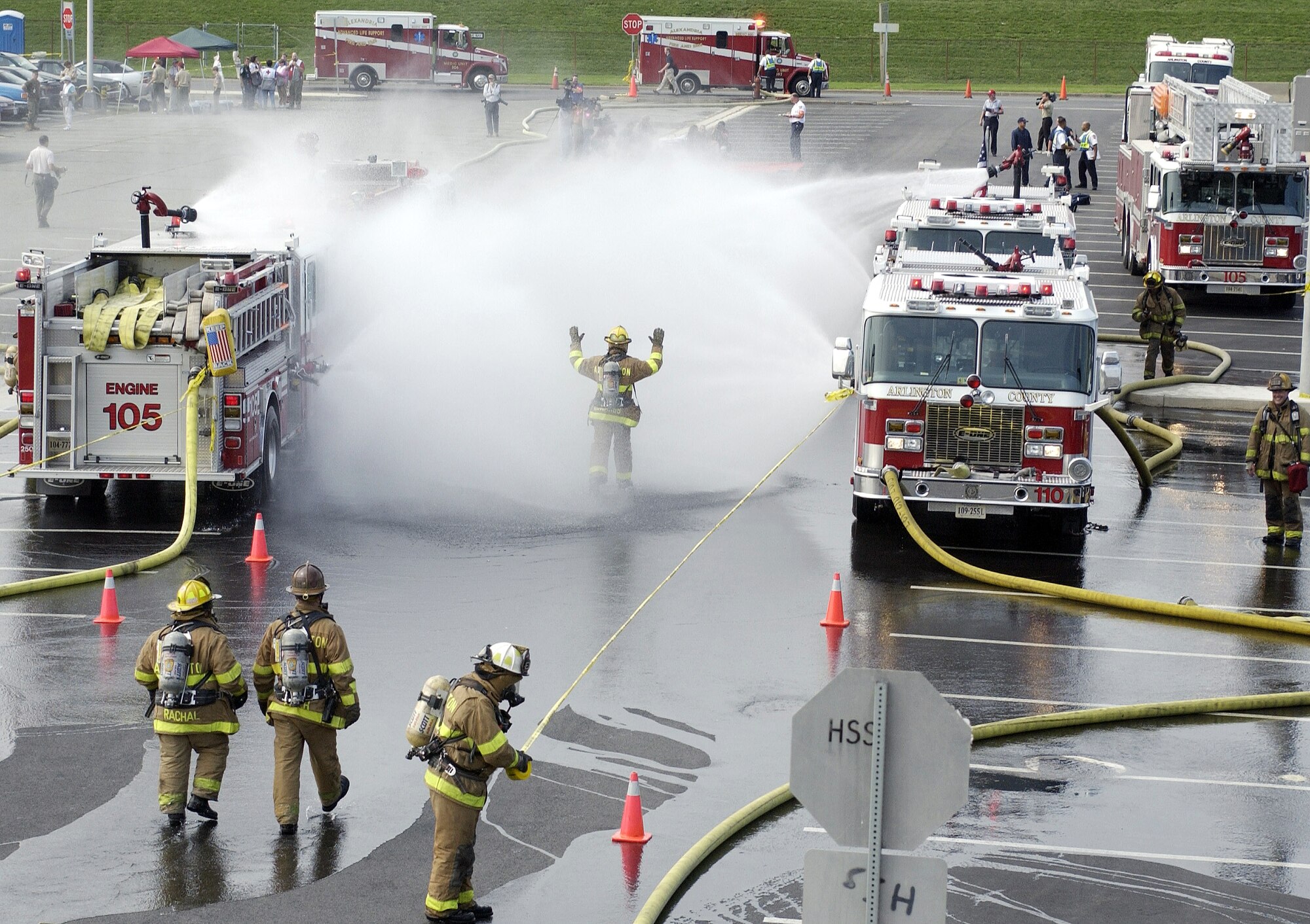 WASHINGTON -- Firefighters from Arlington County, Va., set up a decontamination area in the Pentagon's south parking lot during exercise Gallant Fox on July 24.  Gallant Fox is a large-scale chemical, biological, radiological and nuclear-training exercise conducted by the Pentagon Force Protection Agency.  The exercise provides training in responding to real-world mass casualty scenarios by various local emergency fire, police, medical and hazardous-material response units.  (U.S. Air Force photo by Master Sgt. Jim Varhegyi)
