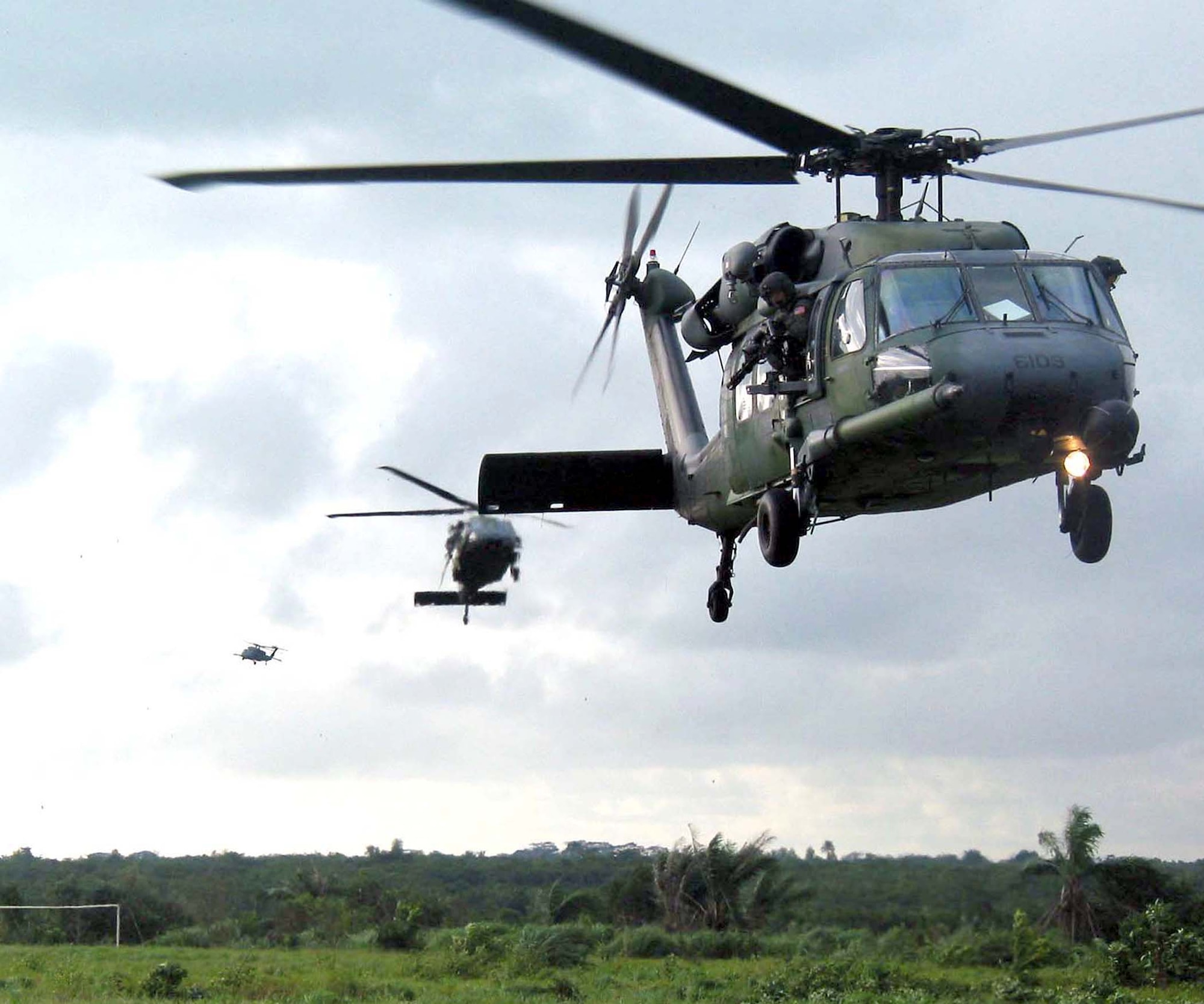 LUNGI, Sierra Leone (AFPN) -- Three HH-60G Pave Hawk helicopters from the 56th Rescue Squadron at Naval Air Station Keflavik, Iceland, carry evacuees from the U.S. Embassy in Liberia on July 23.  The squadron is deployed here to provide personnel recovery and emergency evacuation for the Humanitarian Assistance Survey Team in Liberia.  (U.S. Air Force photo by Capt. Kristi Beckman)