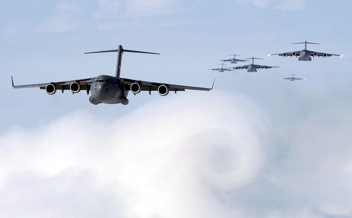 OVER SOUTH CAROLINA -- Six C-17 Globemaster IIIs participate in a training airdrop formation July 27.  In all, nine C-17s from the 437th Airlift Wing at Charleston Air Force Base, S.C., took part.  The scheduled airdrop took place over North Field, S.C.  (U.S. Air Force photo by Staff Sgt. Suzanne Jenkins)
