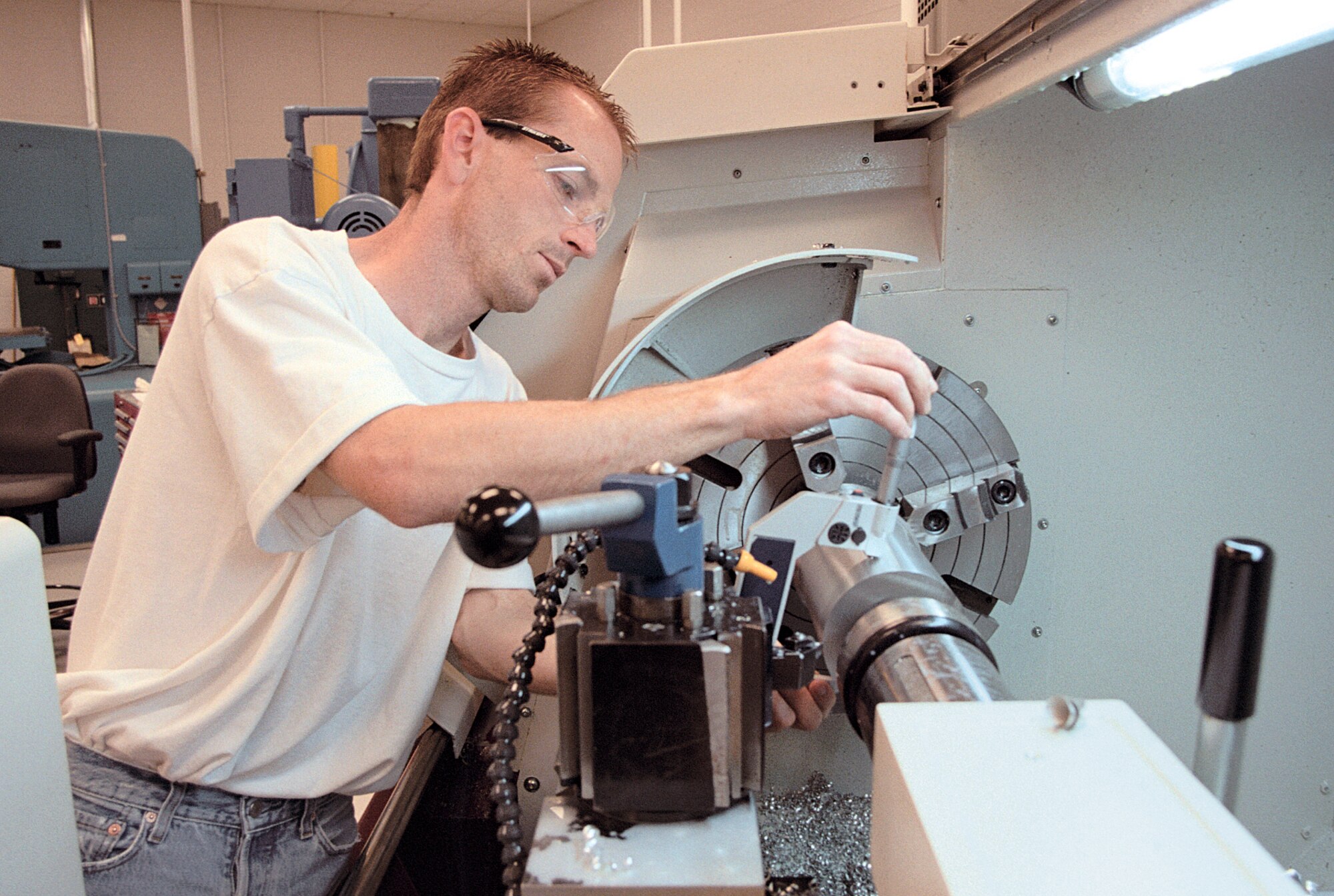 TINKER AIR FORCE BASE, Okla. -- Timothy Case cuts an aluminum sleeve for a turbine housing from a T-38 Talon aircraft.  Case, a worker in the Oklahoma City Air Logistics Center's aircraft accessories branch here, won $10,000 for his sleeve manufacturing idea.  (Courtesy photo)