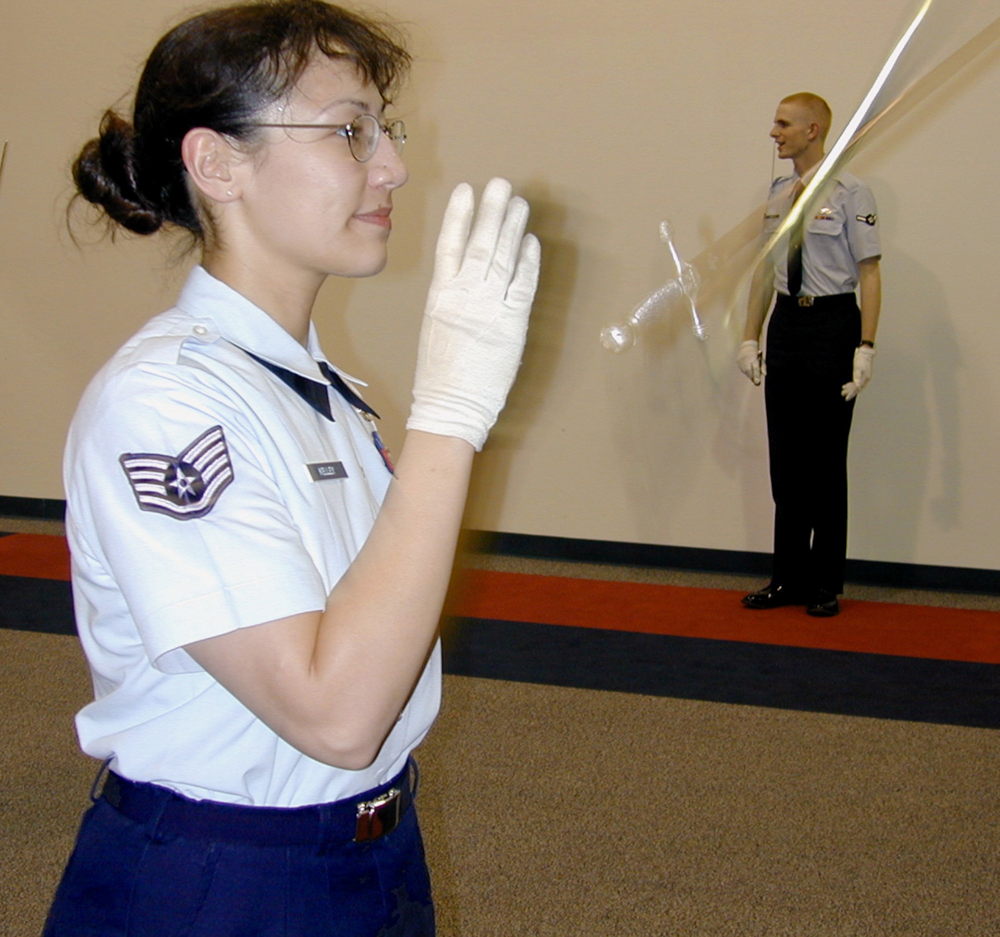 GUNTER ANNEX, Ala. (AFPN) -- Staff Sgt. Jennifer Kelley practices twirling a saber.  Sabre Drill Team members here practice rigorously for intricate maneuvers required during a performance.  (U.S. Air Force photo by Belinda Bazinet)