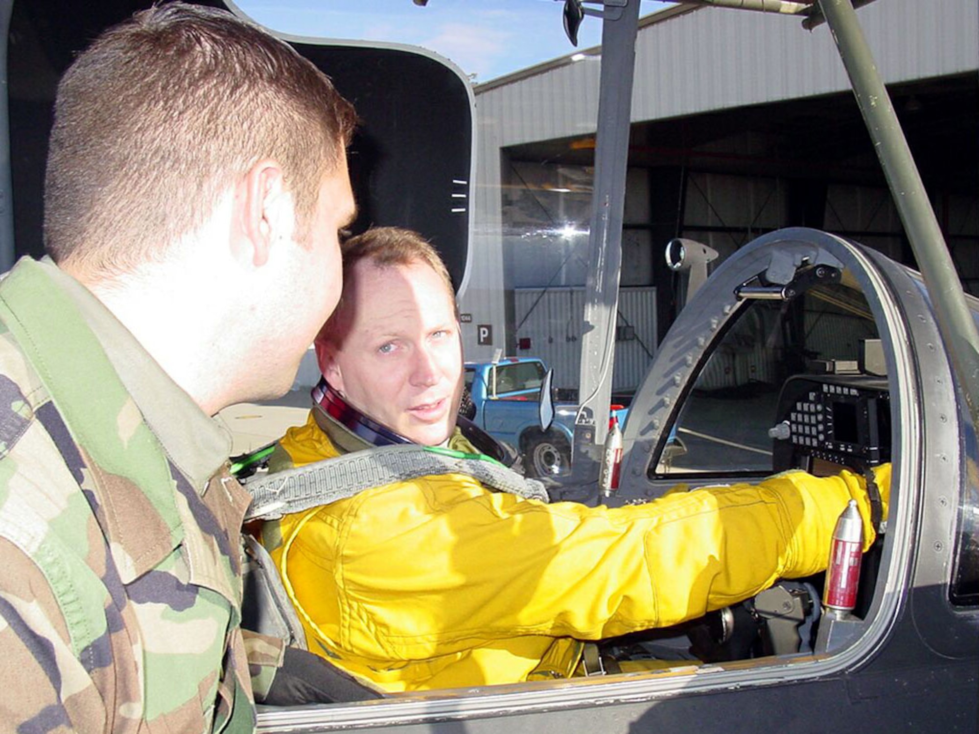 BEALE AIR FORCE BASE, Calif. -- Following a U-2 high flight, Maj. Jeffrey Olesen, the recipient of the 2002 Koren Kolligian Jr. Trophy, gives some feedback to Senior Airman Josh Ordiway, a crew chief with the 9th Aircraft Maintenance Squadron here.  (Air Force photo by Tech. Sgt. James Brabenec)