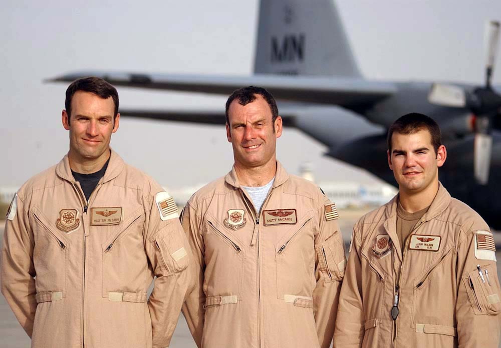 OPERATION IRAQI FREEDOM -- Brothers Master Sgt. Tim McCann (left) and Lt. Col. Matt McCann and their nephew, Senior Airman Jason McCann, deployed for the first time together to support Operation Iraqi Freedom.  The McCann men are members of the Minnesota Air National Guard and assigned to the 772nd Expeditionary Airlift Squadron at a forward-deployed location.  Matt is a C-130 Hercules pilot. Tim and Jason are C-130 loadmasters.  (U.S. Air Force photo by Staff Sgt. Pamela Smith)