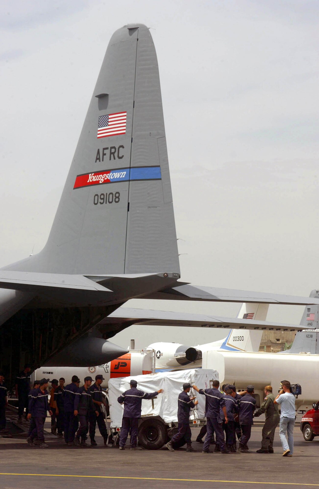 ALGIERS, Algeria -- Airmen of the 910th Airlift Wing, an Air Force Reserve unit from Youngstown, Ohio, unload humanitarian relief supplies from a C-130 Hercules aircraft in earthquake-stricken Algeria.  Two C-130s from 123rd Air National Guard, Louisville, Ky., also flew supplies from Ramstein Air Base, Germany.  (U.S. Air Force photo by Master Sgt. John Lasky)