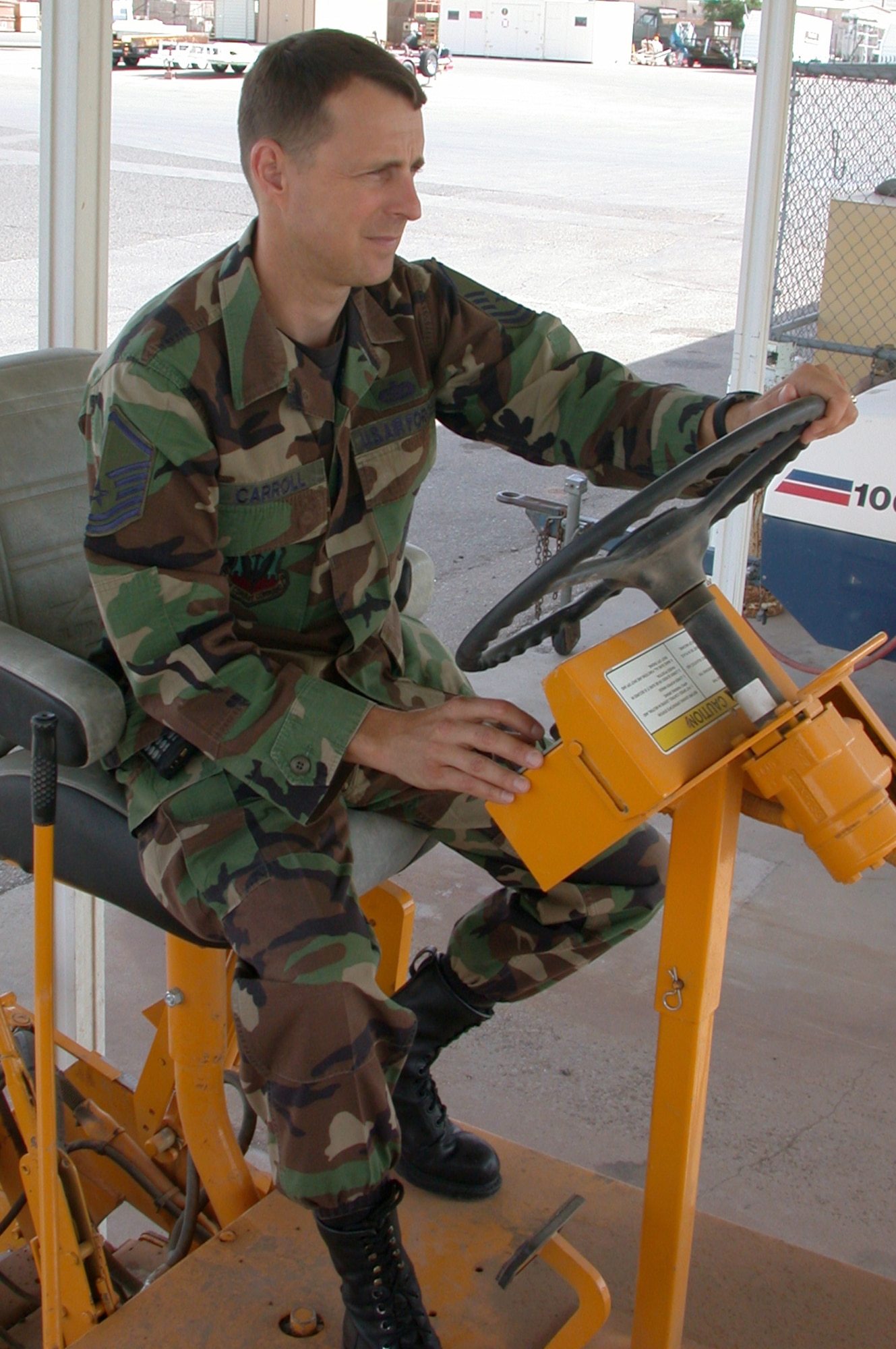 HOLLOMAN AIR FORCE BASE, N.M. -- Master Sgt. Marshall Carroll drives a paver that earned him $10,000 through the Innovative Development through Employee Awareness program.  He is the 49th Civil Engineer Squadron horizontal-construction superintendent and earned another $10,000 for suggesting the base buy an asphalt zipper to tear up and recycle old pavement.  (U.S. Air Force photo by Laura Pellegrino)