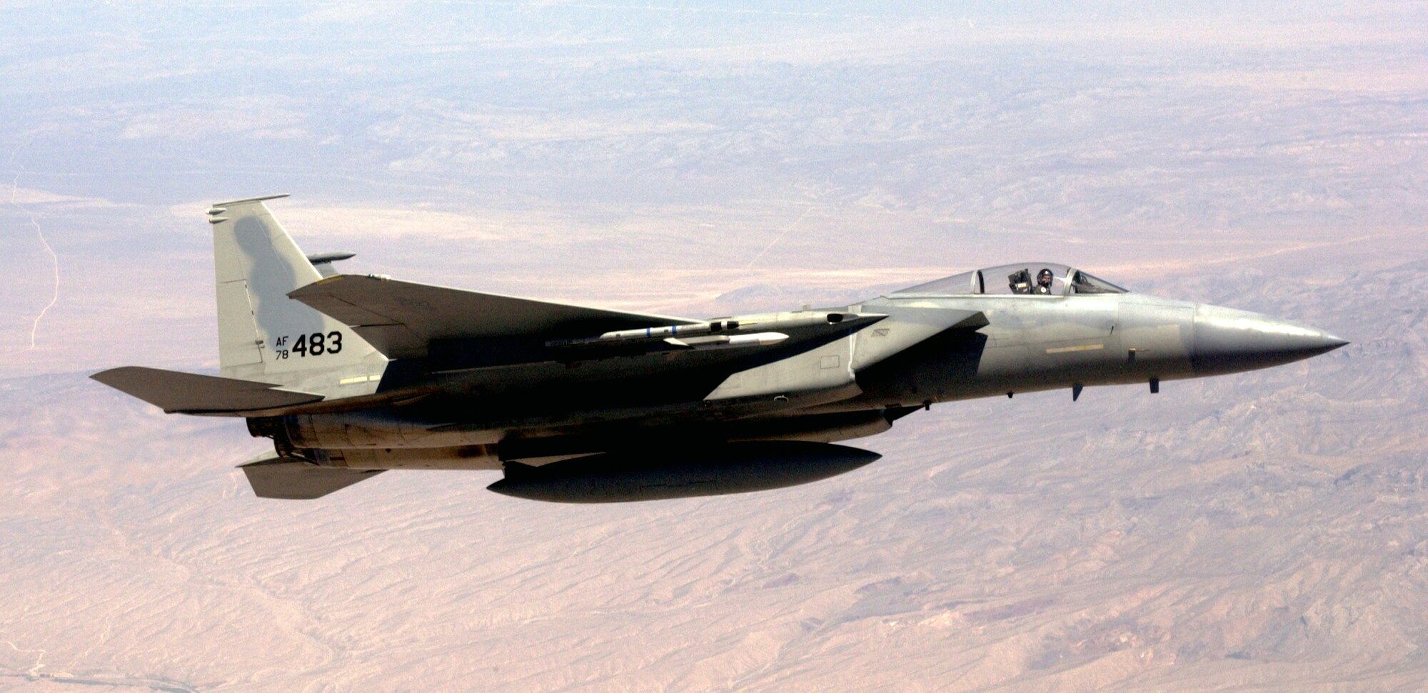 NELLIS AIR FORCE BASE, Nev. -- An F-15C flies over the desert during a mission on June 2.  The Eagle is participating in the U.S. Air Force Weapons Schools Mission Employment Exercise. The exercise is a two-week battle simulation, bringing all the various weapon schools from around the country to Nevada, testing the skills students learned over several months of training.  (U.S. Air Force photo by Tech. Sgt. Robert W. Valenca)