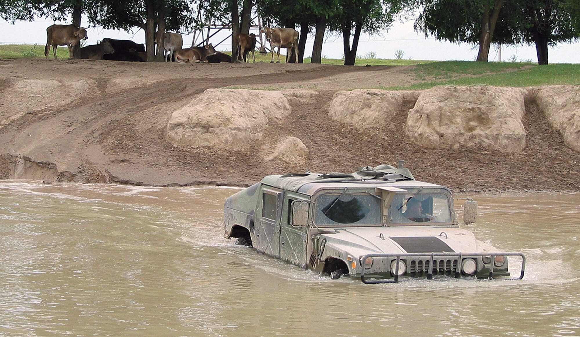 GANCI AIR BASE, Kyrgyzstan -- The 376th Expeditionary Security Forces Squadron is responsible for patrolling areas outside the perimeter of Ganci Air Base, Kyrgyzstan.  The terrain is rough and Humvees are needed to get around.  (U.S. Air Force photo by Staff Sgt. Jason Smith)