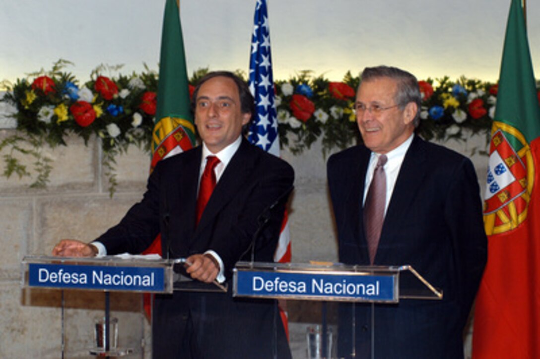 Portuguese Minister of State & Defense Paulo Portas (left) and Secretary of Defense Donald H. Rumsfeld (right) participate in a joint press conference at the conclusion of their bilateral security discussions held at Fort Sao Juliao in Lisbon, Portugal, on June 10, 2003. Rumsfeld is in Europe on a four-day trip to meet with allies and attend the annual spring meeting of NATO defense ministers in Brussels, Belgium. 