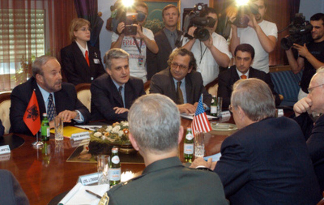 Albanian Prime Minister Fatos Nano (left) and Minister of Defense Pandeli Majko (2nd from left), and other senior officials of the Albanian government, meet with Secretary of Defense Donald H. Rumsfeld (center foreground) in Tirana, Albania, on June 10, 2003. Rumsfeld is in Europe on a four-day trip to meet with allies and attend the annual spring meeting of NATO defense ministers in Brussels, Belgium. Rumsfeld stopped in Albania to discuss a broad range of security issues and Albania's interest in joining NATO. 