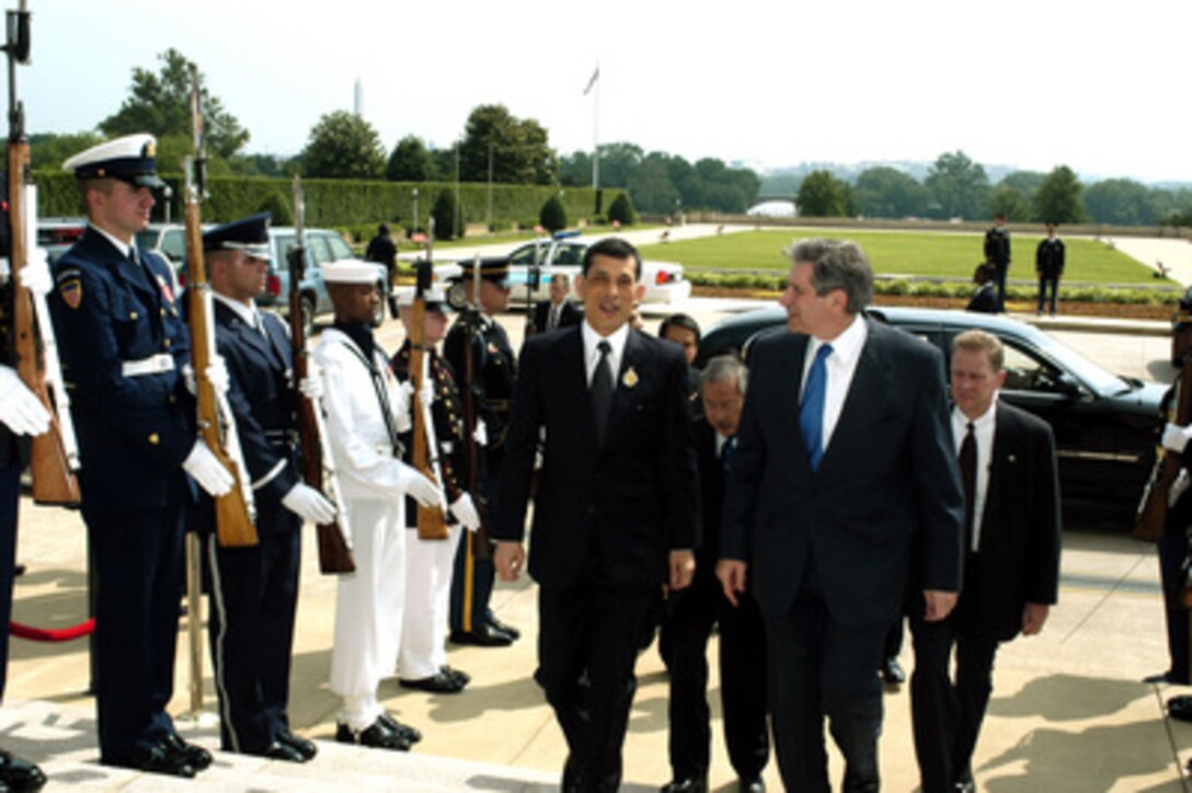 Deputy Secretary of Defense Paul Wolfowitz (right) escorts Thailand's Crown Prince Maha Vajiralongkorn through an honor cordon and into the Pentagon on June 12, 2003. Wolfowitz and the Prince will meet to discuss a range of bilateral security issues and the global war on terror. 