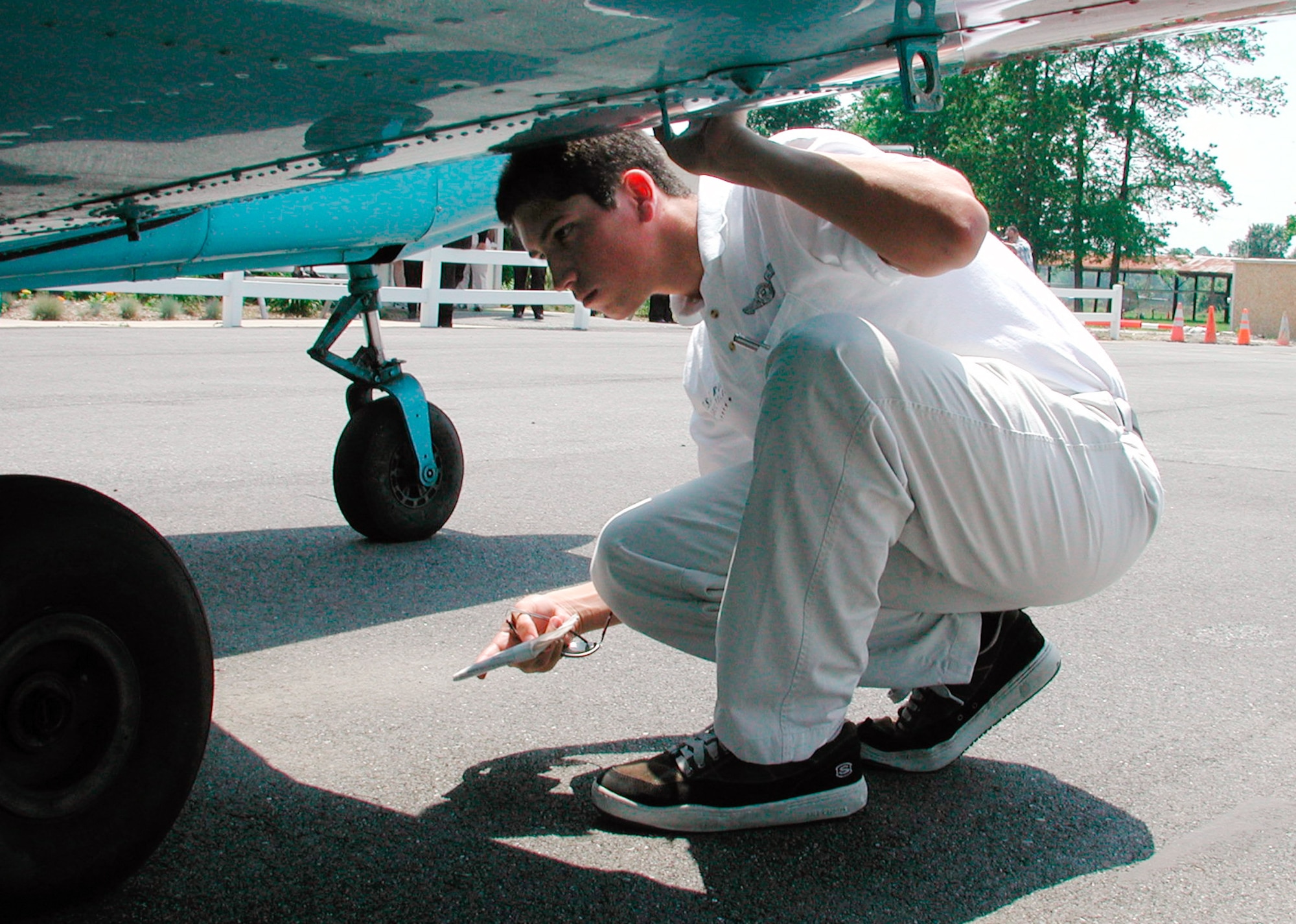 DOVER AIR FORCE BASE, Del. -- Manuel R. Ochoa inspects a Piper Warrior during Flight Awareness Summer Training here recently.  He is an Air Force ROTC cadet from New Mexico State University.  (U.S. Air Force photo by 2nd Lt. Sara Banda)