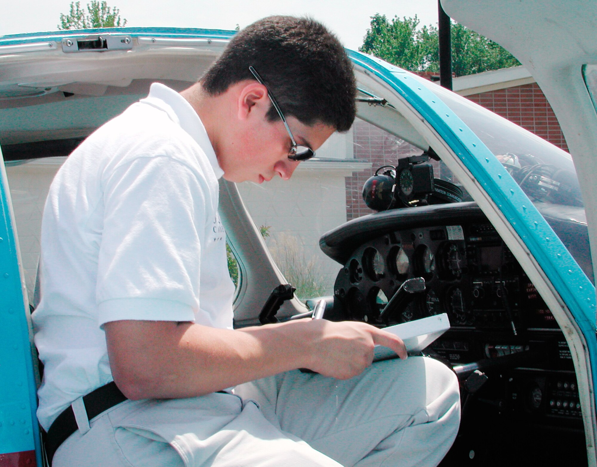 DOVER AIR FORCE BASE, Del. -- Manuel R. Ochoa inspects a Piper Warrior during Flight Awareness Summer Training here recently.  He is an Air Force ROTC cadet from New Mexico State University.  (U.S. Air Force photo by 2nd Lt. Sara Banda)