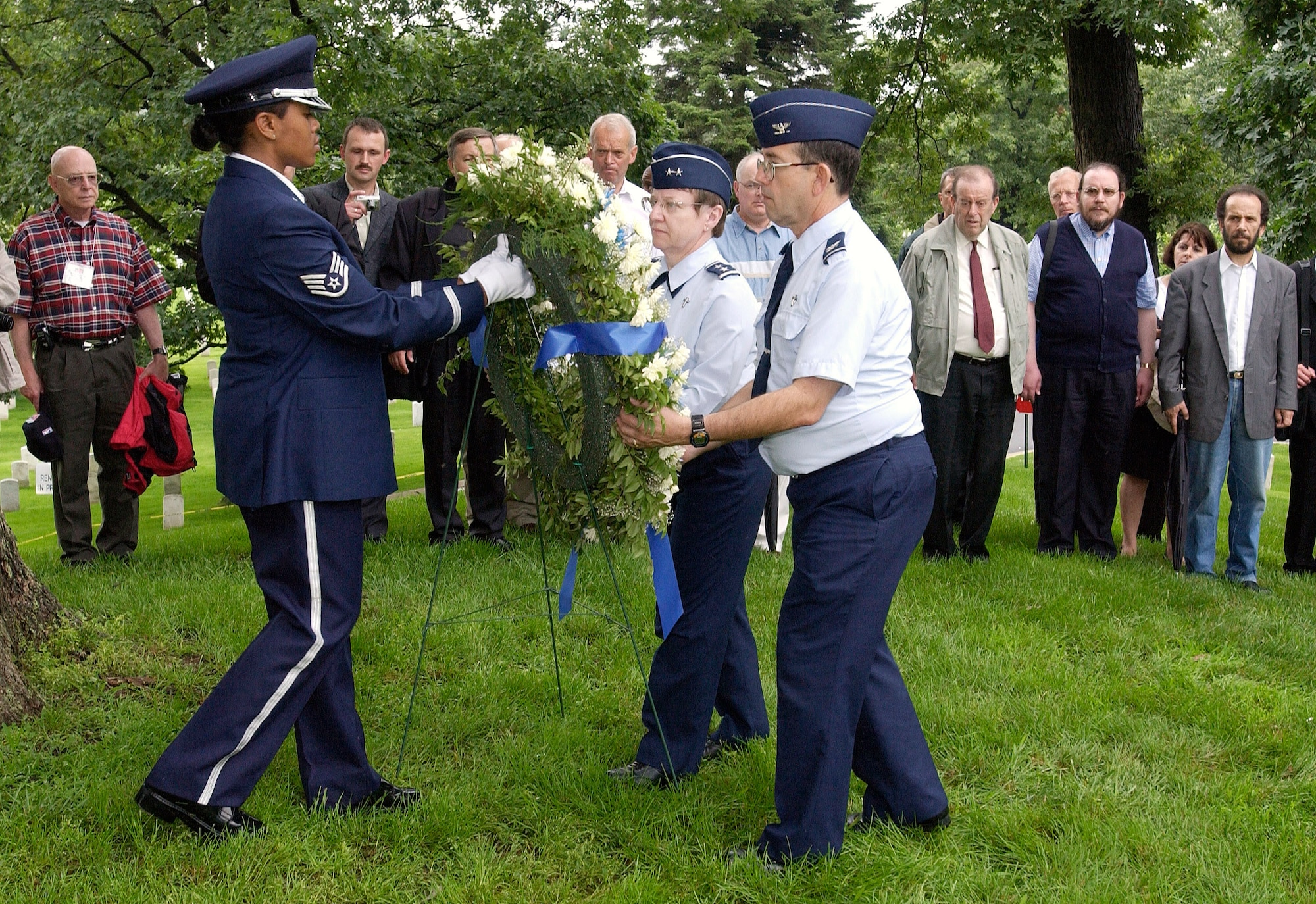 ARLINGTON, Va. (AFPN) -- Chief of Air Force Chaplain Service, Chap. (Maj. Gen.) Lorraine Potter (left), and Chap. (Col.) Darrell Morton salute during a memorial and wreath-laying service at Arlington National Cemetery on June 19.  The NATO chaplains are in the Washington area for a weeklong NATO Allied Air Force Chief of Chaplains Consultative Conference.  (U.S. Air Force photo by Master Sgt. Jim Varhegyi)