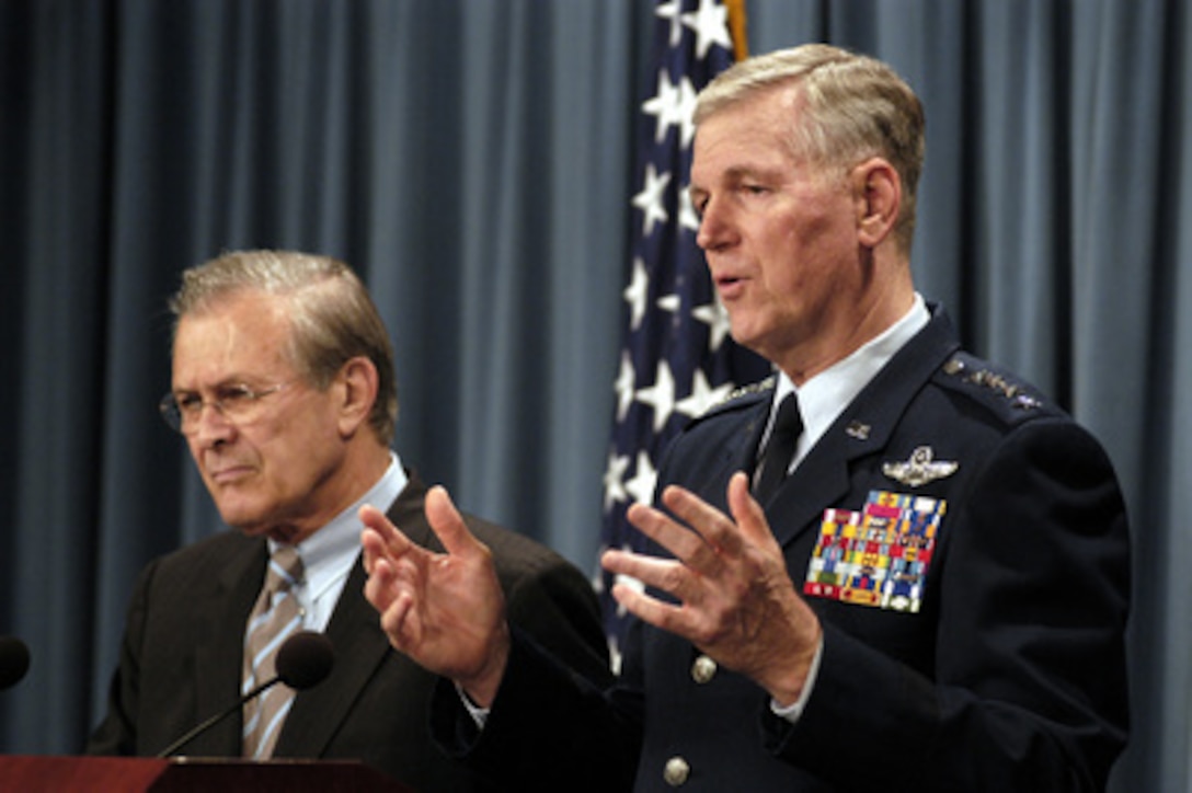 Chairman Joint Chiefs of Staff Gen. Richard B. Myers, USAF, responds to a reporter's question during a press briefing with Secretary of Defense Donald H. Rumsfeld at the Pentagon on June 24, 2003. 