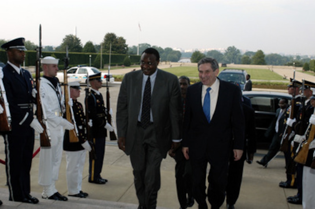 Deputy Secretary of Defense Paul D. Wolfowitz escorts Minister of State for Provincial Administration and National Security of Kenya Dr. Chris Murangaru into the Pentagon June 25, 2003. The defense leaders are meeting to discuss military issues of mutual interest. 