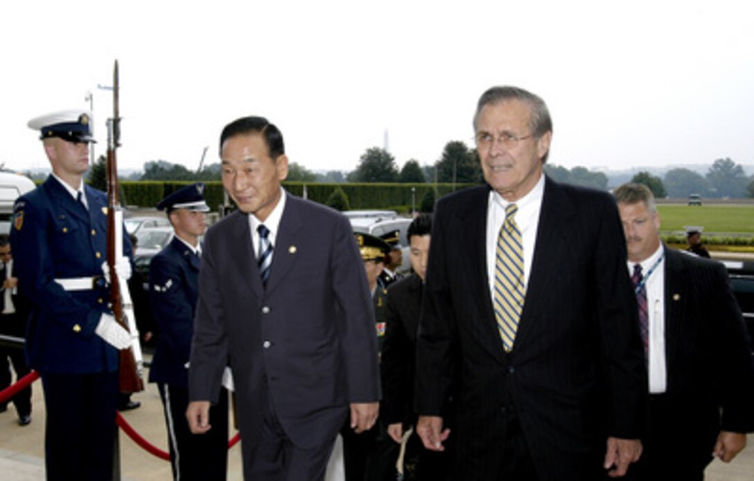 Secretary of Defense Donald H. Rumsfeld (right) escorts South Korean Minister of National Defense Cho Yong-kil into the Pentagon on the afternoon of June 27, 2003. The two defense leaders will meet to discuss a broad range of bilateral security issues. 