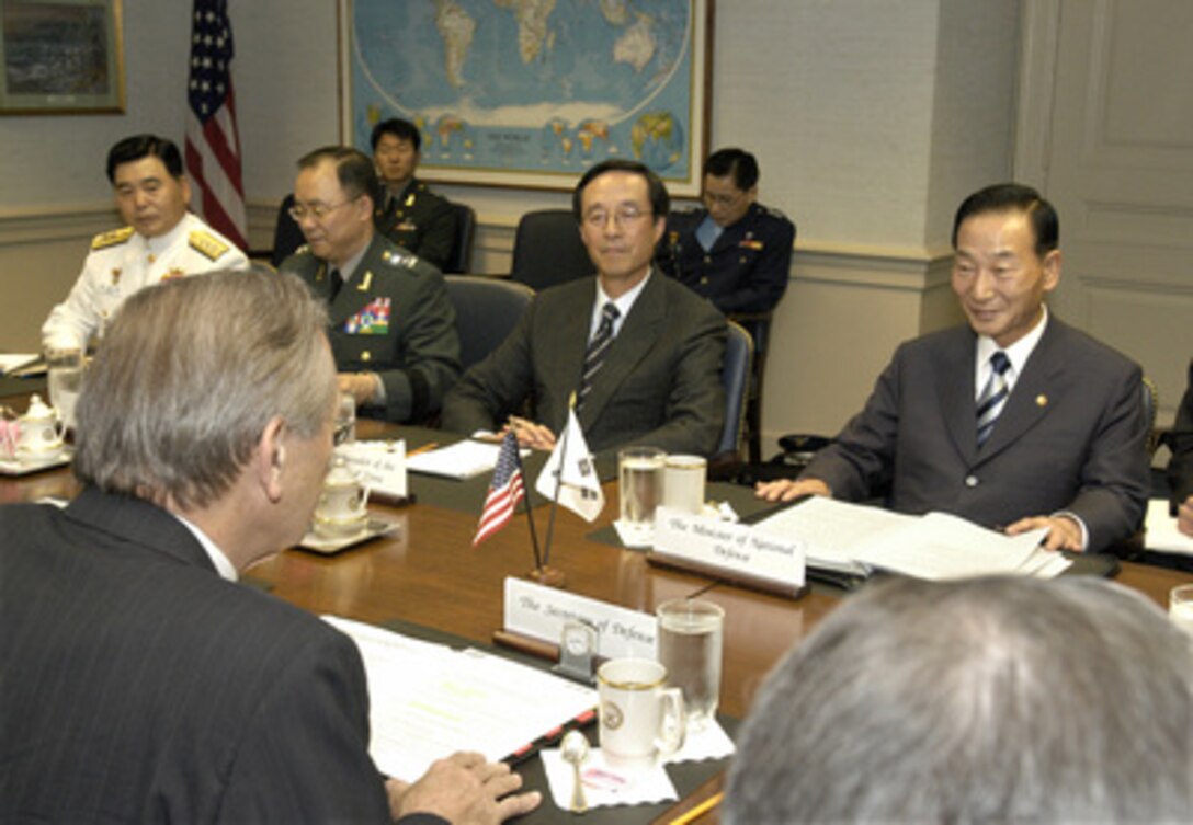 Minister of National Defense Cho Yong-kil (right), of the Republic of Korea, meets at the Pentagon June 27, 2003, with Secretary of Defense Donald H. Rumsfeld (left foreground). Under discussion is a broad range of bilateral security issues. Also participating in the meeting, on the Korean side of the table, are (left to right): Rear Adm. Jung Byung-chil, director of strategic Planning; Maj. Gen. Kim Seon-kyu, director general of the Policy Planning Bureau, and His Excellency Han Sung-chu, ambassador to the United States. 
