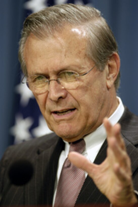 Secretary of Defense Donald H. Rumsfeld gestures as he explains why the present situation in Iraq is not a guerrilla conflict during a Pentagon press briefing on June 30, 2003. Rumsfeld and Chairman of the Joint Chiefs of Staff Gen. Richard B. Myers, U.S. Air Force, gave reporters an operational update on Operation Iraqi Freedom. 