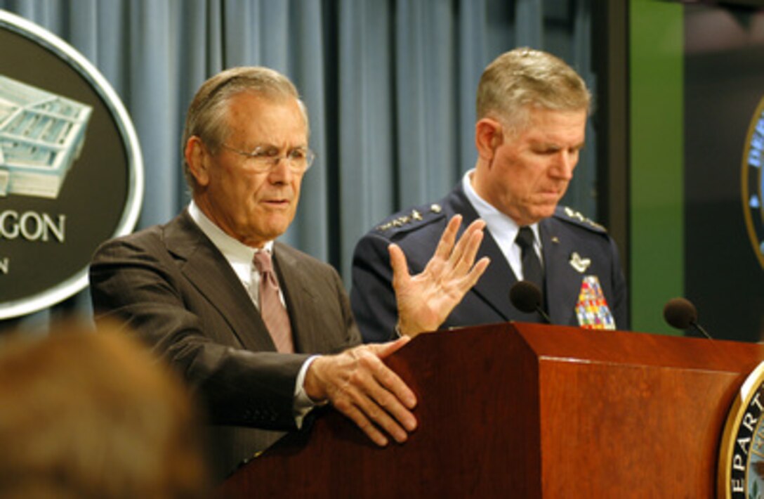 Secretary of Defense Donald H. Rumsfeld and Chairman of the Joint Chiefs of Staff Gen. Richard B. Myers, U.S. Air Force, update Pentagon reporters on the progress of Operation Iraqi Freedom during a Department of Defense press briefing on June 30, 2003. 