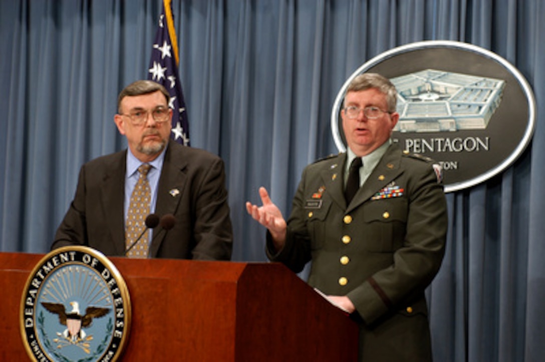 Deputy Director of the Deployment Health Support Directorate Dr. Michael Kilpatrick (left) and Army Col. James Naughton, Army Material Command, brief reporters on the military uses of depleted uranium and its minimal impact on health and the environment during a Pentagon press briefing on March 14, 2003. 