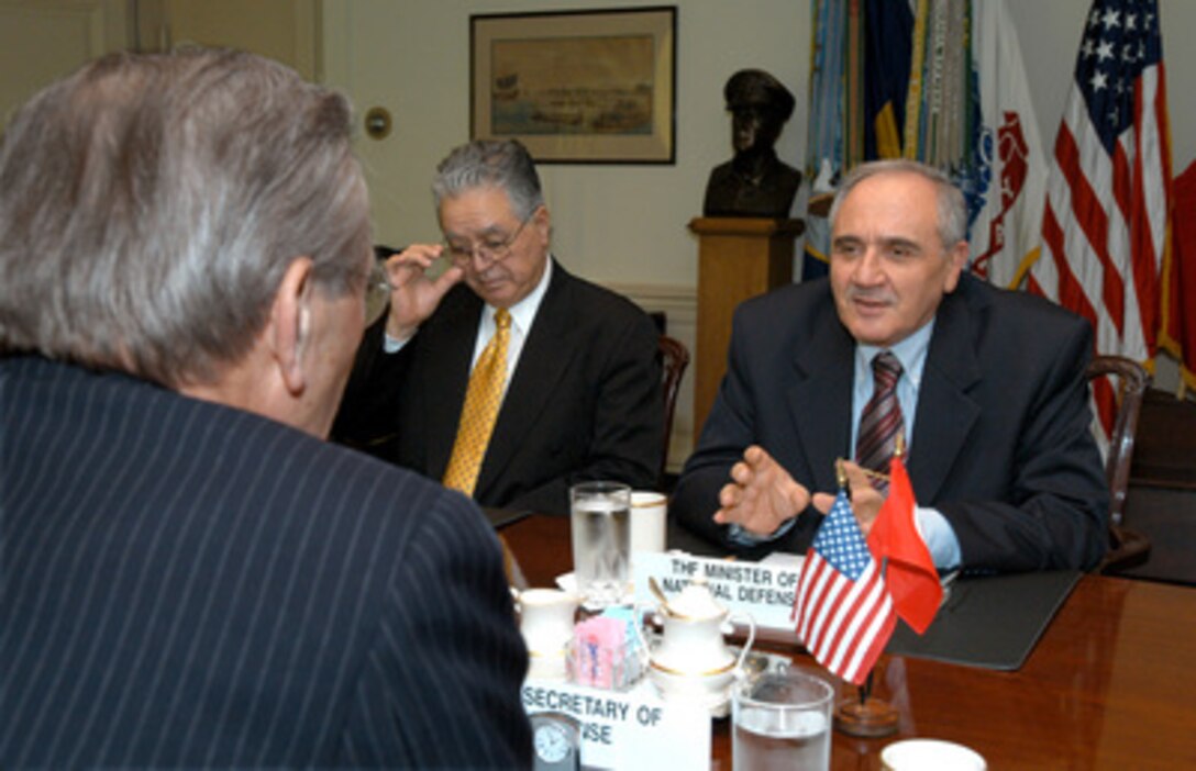 Turkish Minister of National Defense Vecdi Gonul (right) and Ambassador to the United States Faruk Logoglu meet with Secretary of Defense Donald H. Rumsfeld in the Pentagon on March 18, 2003. Gonul, Logoglu and Rumsfeld are meeting to discuss regional security issues of interest to both nations. 