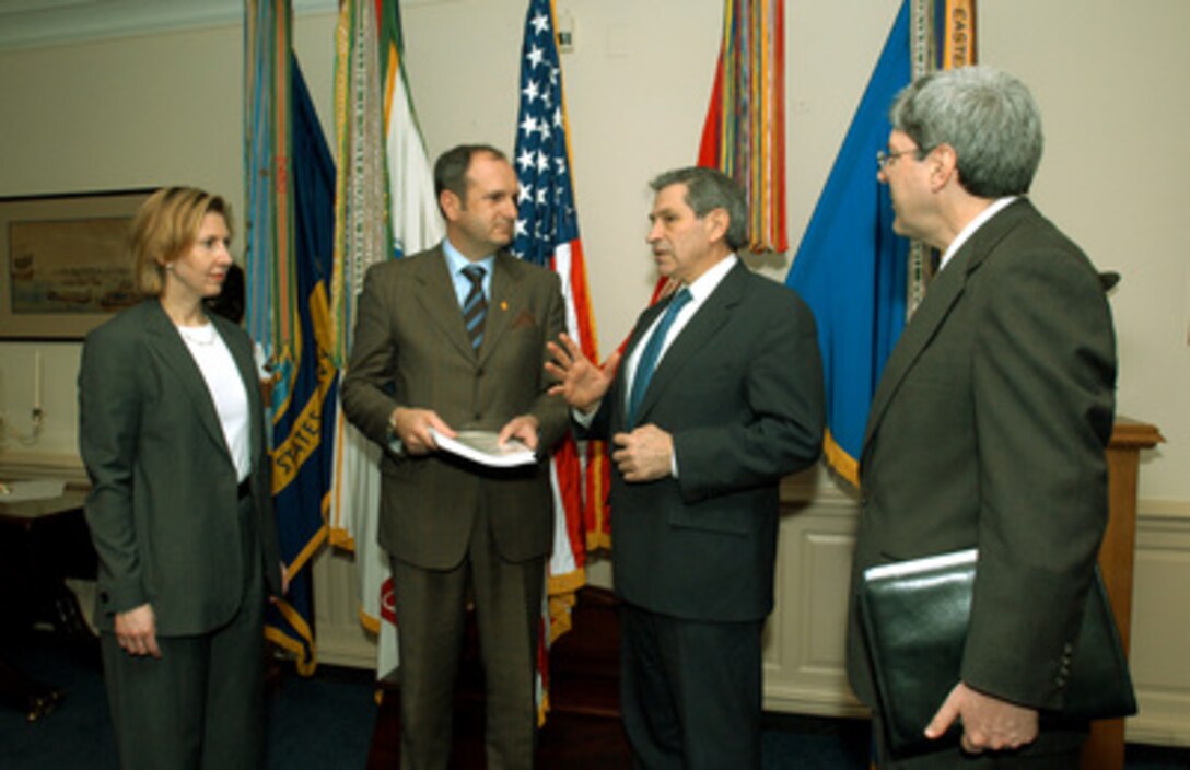 Deputy Secretary of Defense Paul Wolfowitz (2nd from right) talks with Minister of Defense Vlado Buchkovski (2nd from left), of the Former Yugoslav Republic of Macedonia, in the Pentagon on March 18, 2003. Wolfowitz presented Buchkovski a copy of the "Defense Assessment for the Republic of Macedonia" which is a document prepared by the Department of Defense to assist Macedonia in the structuring of its armed forces. Deputy Assistant Secretary of Defense for Eurasian Affairs Mira Ricardel (left) and Under Secretary of Defense for Policy Douglas Feith (right) will hold further detailed security discussions with Buchkovski. 