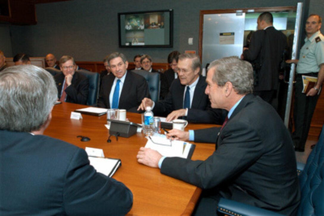 Secretary of Defense Donald H. Rumsfeld (2nd from right) introduces President George W. Bush (right) to participants at a briefing in the Pentagon on March 25, 2003. Bush visited the Pentagon to meet with the senior defense leadership and announce his $74.7 billion wartime supplemental budget request. Once appropriated by Congress, the money will pay for the direct costs of the Iraqi conflict and the global war against terror. 