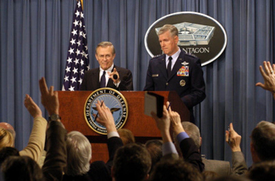 Secretary of Defense Donald H. Rumsfeld calls on a reporter during a Pentagon press briefing on March 25, 2003. Rumsfeld and Chairman of the Joint Chiefs of Staff Gen. Richard B. Myers, U.S. Air Force, updated reporters on the progress of Operation Iraqi Freedom. Operation Iraqi Freedom is the multinational coalition effort to liberate the Iraqi people, eliminate Iraq's weapons of mass destruction and end the regime of Saddam Hussein. 