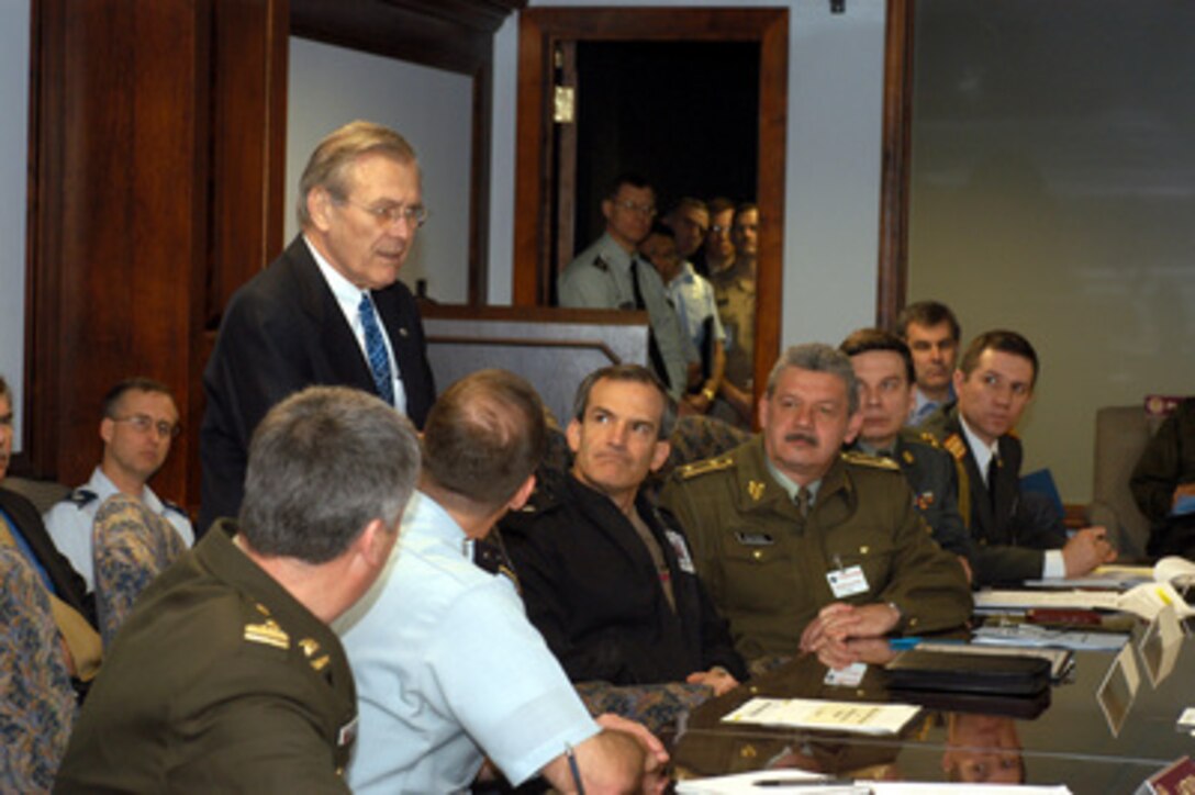 Secretary of Defense Donald H. Rumsfeld speaks to defense attachés and representatives from 26 of the Operation Iraqi Freedom coalition nations gathered at the Pentagon for a meeting on March 27, 2003. Operation Iraqi Freedom is the multinational coalition effort to liberate the Iraqi people, eliminate Iraq's weapons of mass destruction and end the regime of Saddam Hussein. 