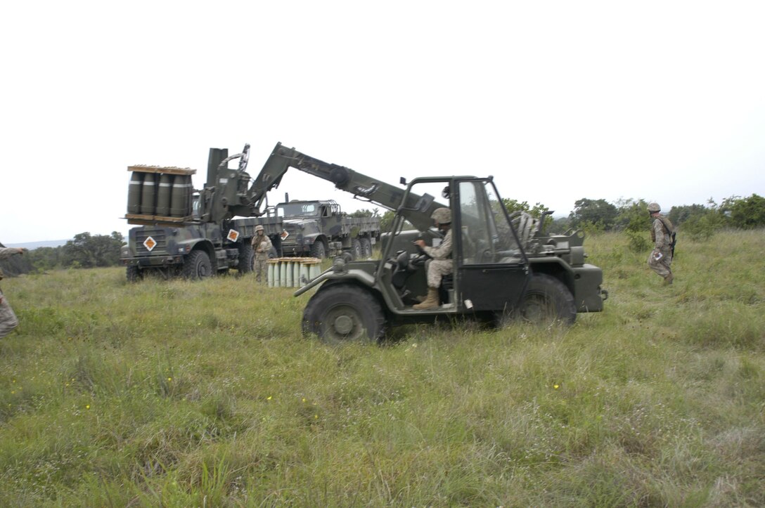 Lance Cpl. Brandon Clowdus, a heavy equipment operator with Headquarters Battery, 14th Marine Regiment, based in Fort Worth, Texas operates a “Terex” rough-terrain forklift to unload artillery rounds and other ammunition off of a MK-23 7-ton logistics vehicle here June 10. Reserve Marines of 14th Marine Regiment batteries conducted live-fire artillery exercises June 6 - 20. The resupply of ammunition and artillery was delivered by Bulk Fuel Platoon, 6th Motor Transport Company in support of Marine Forces Reserve exercise Javelin Thrust 2009.