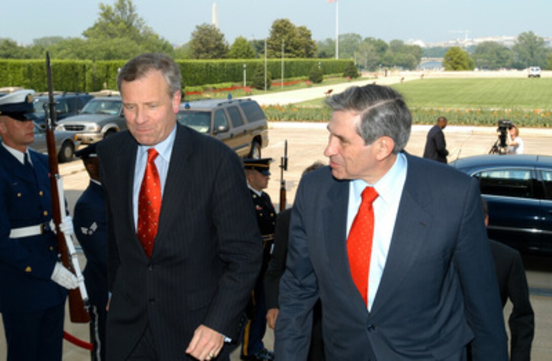 Deputy Secretary of Defense Paul Wolfowitz (right) escorts Netherlands's Minister of Foreign Affairs Jaap de Hoop Scheffer into the Pentagon on May 1, 2003. The two men will meet to discuss bilateral security issues of interest to both nations. 