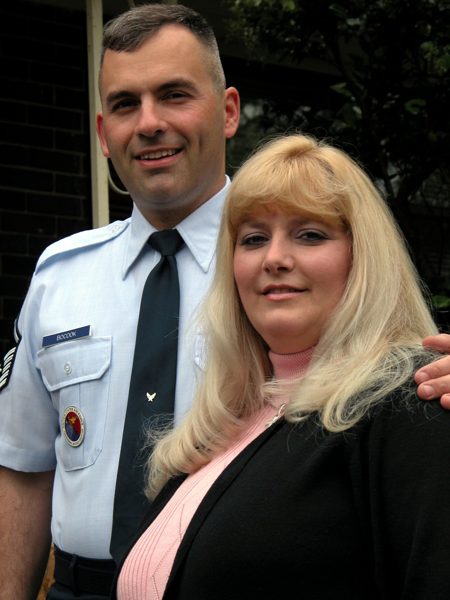 ROBINS AIR FORCE BASE, Ga. (AFPN) -- Tammie Bocook stands with her husband of more than 16 years, Master Sgt. Ray Bocook.  She was named the 2003 Joan Orr Air Force Spouse of the Year.  (U.S. Air Force photo by Sue Sapp)