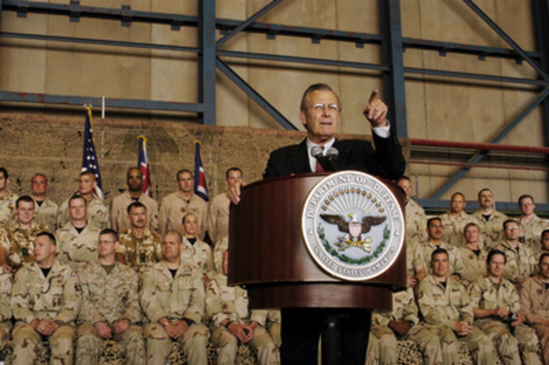 Secretary of Defense Donald H. Rumsfeld calls on military personnel with questions during a town hall meeting at Prince Sultan Air Base, Saudi Arabia, on April 29, 2003. Rumsfeld is visiting the troops and senior leadership in the Persian Gulf region. 