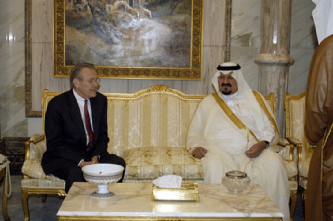 Secretary of Defense Donald H. Rumsfeld poses for photographs with Saudi Minister of Defense and Aviation Prince Sultan bin Abd al-Aziz Al Saud, prior to their meeting in Riyadh, Saudi Arabia, on April 29, 2003. Rumsfeld is visiting the troops and senior leadership in the Persian Gulf region. 