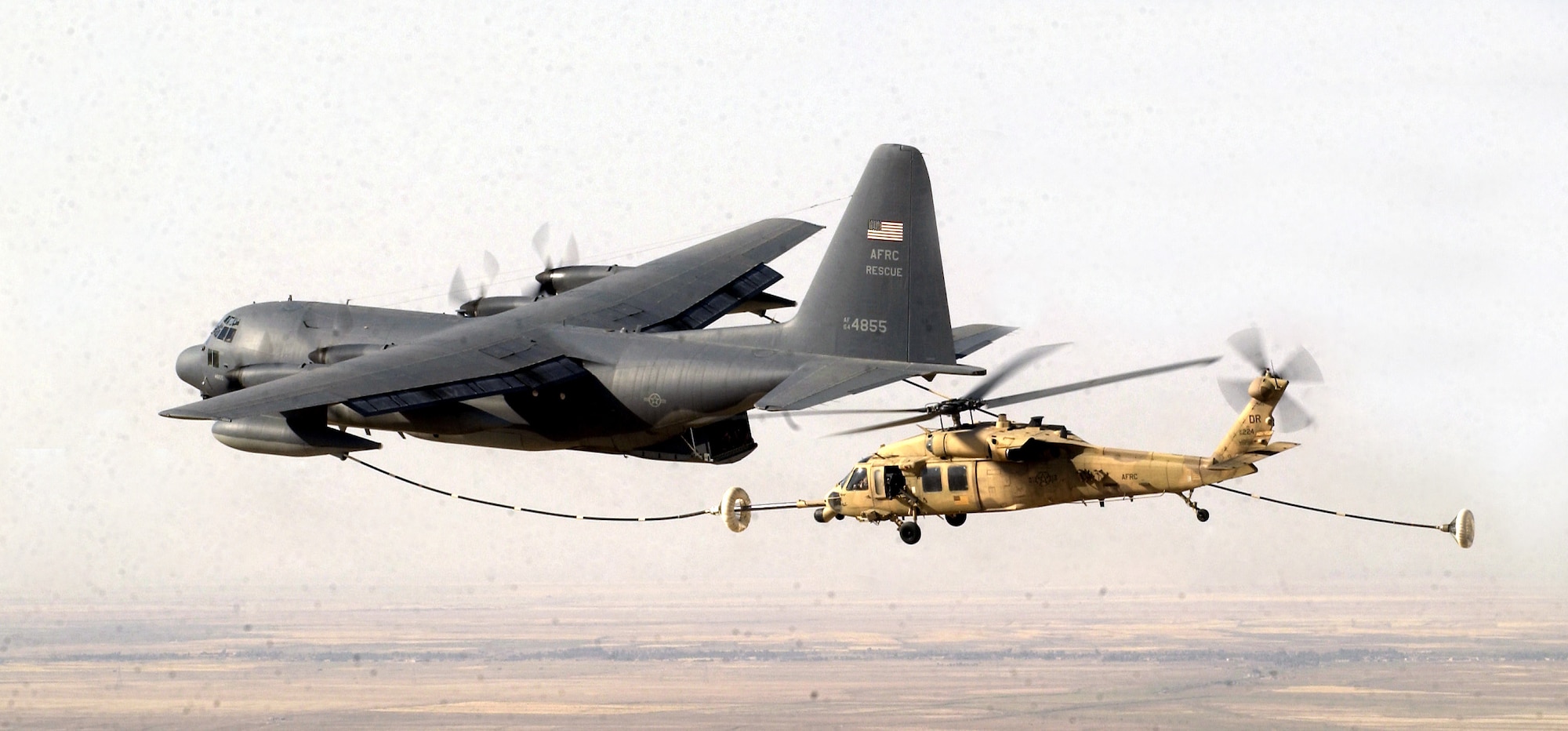 OPERATION IRAQI FREEDOM (AFPN) -- An HH-60G Pave Hawk receives fuel from an HC-130 on May 5 in support of Operation Iraqi Freedom.  Both aircraft belong to Air Force Reserve Command's 920th Rescue Wing at Patrick Air Force Base, Fla.  (U.S. Air Force photo by Staff Sgt. Shane A. Cuomo)